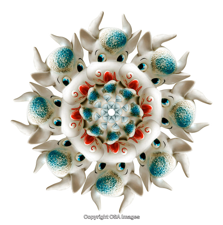 Symmetrical Arrangement of Artistic White and Blue Animal Figures on White Background