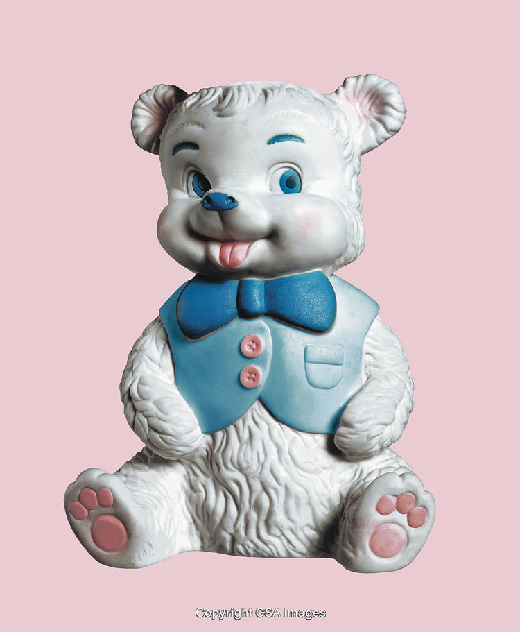 White Bear Figurine With Blue Vest and Bow on Pink Background
