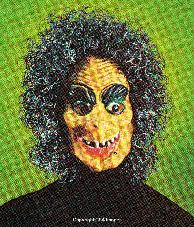 Close-Up of a Stylized Halloween Mask Against Green Background
