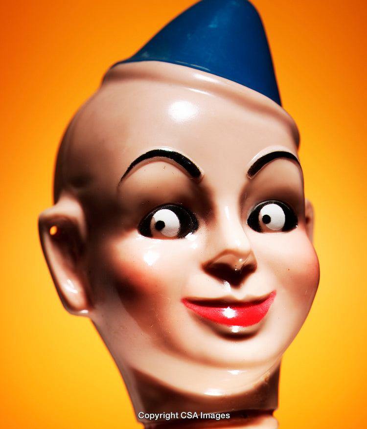 Close-Up of a Colorful Toy Head Against a Bright Background