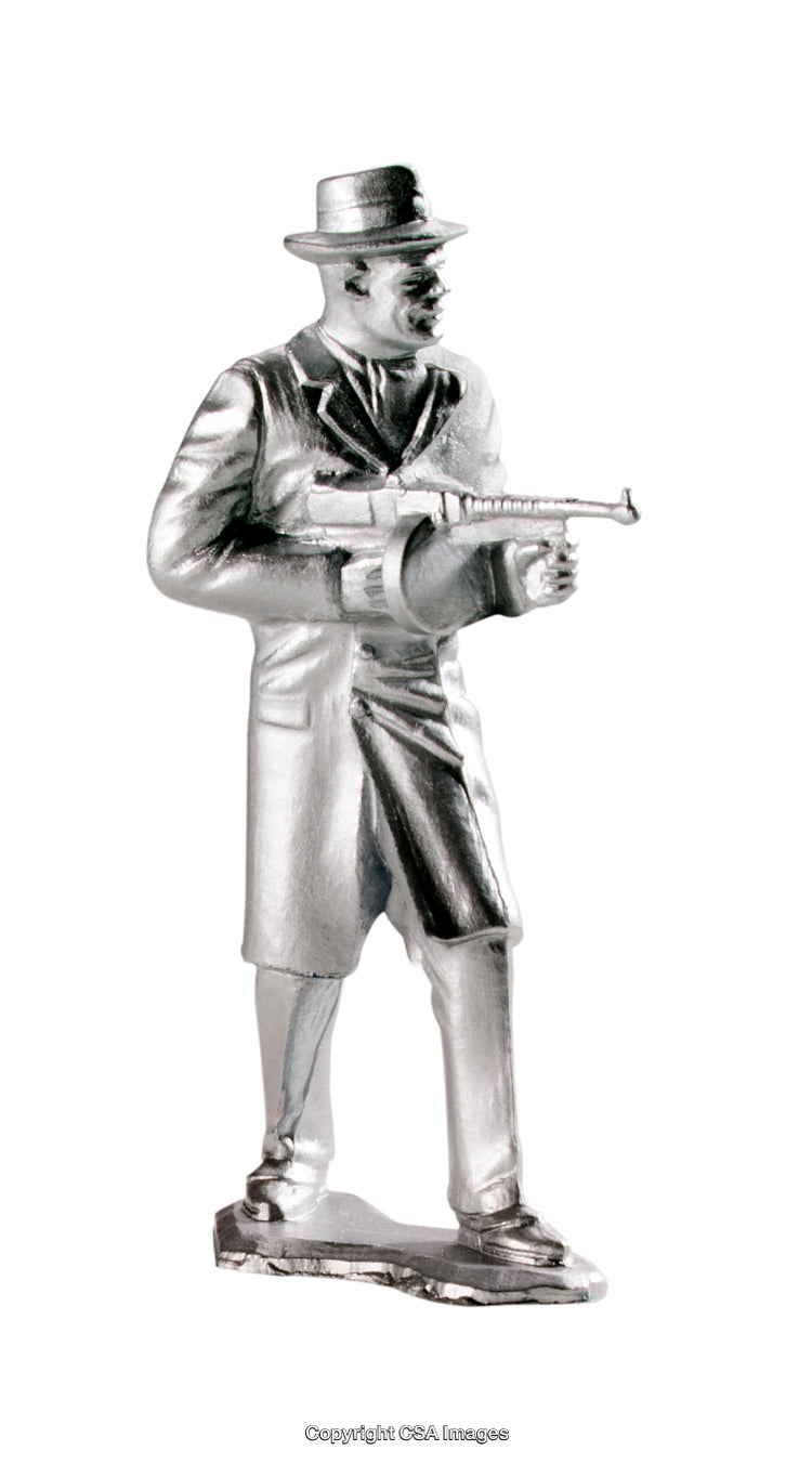 Plastic Figure of a Classic Detective Holding a Toy Machine Gun