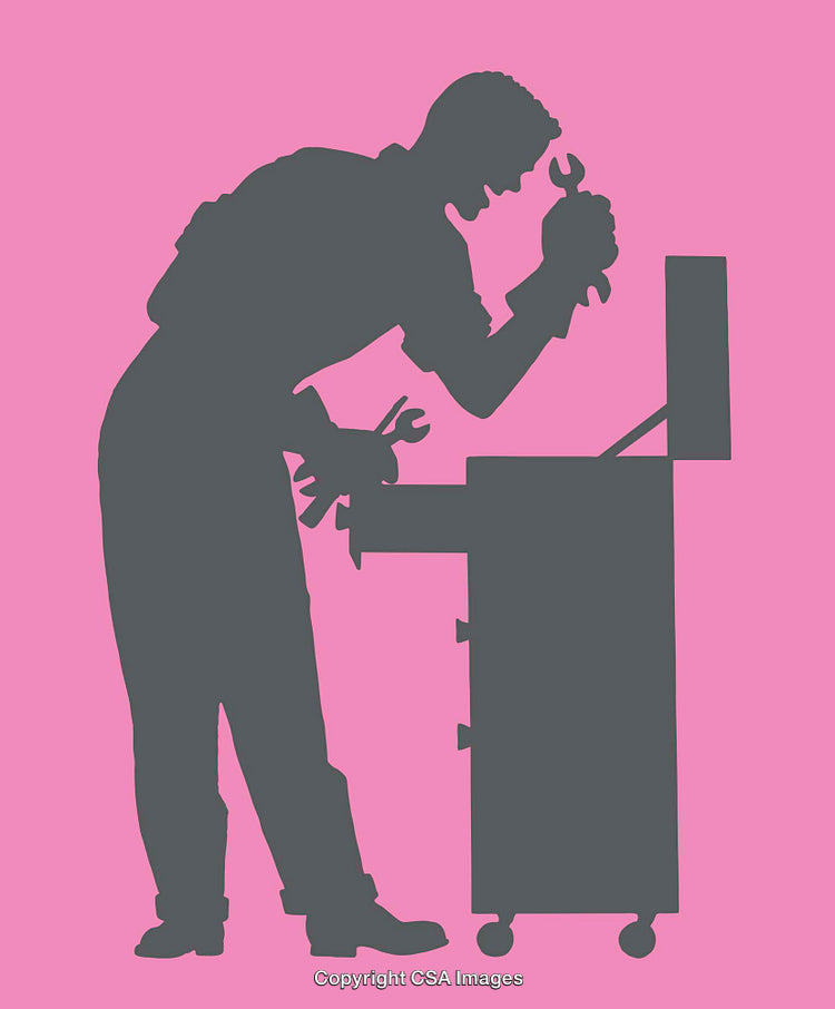 Silhouetted Mechanic Adjusting Tools at Workbench on Pink Background