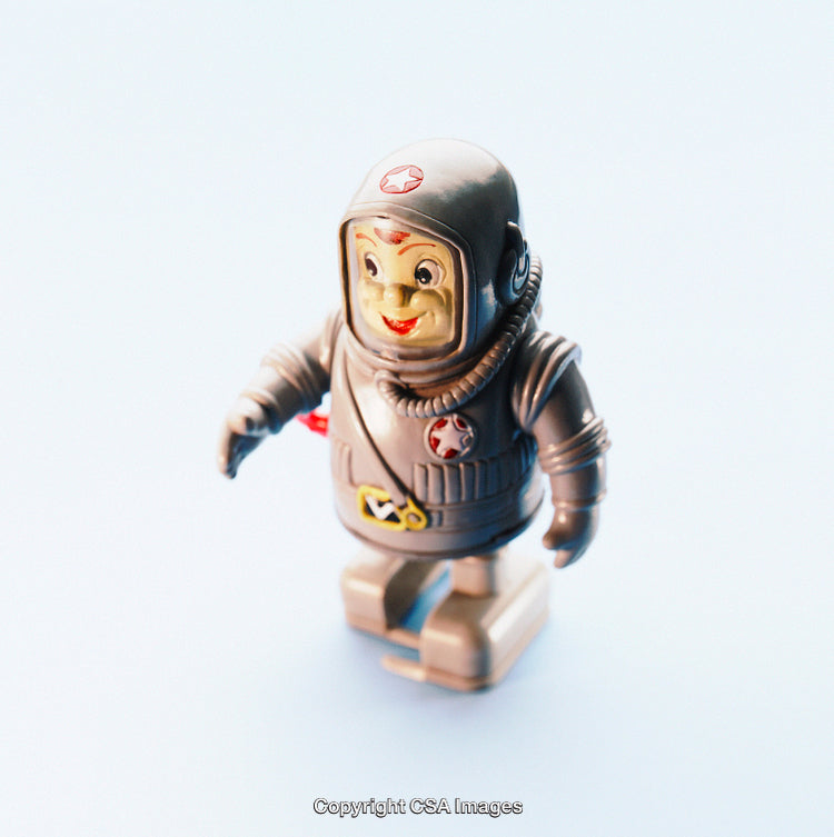 Vintage Plastic Toy Astronaut Figure in Detailed Spacesuit on Light Background