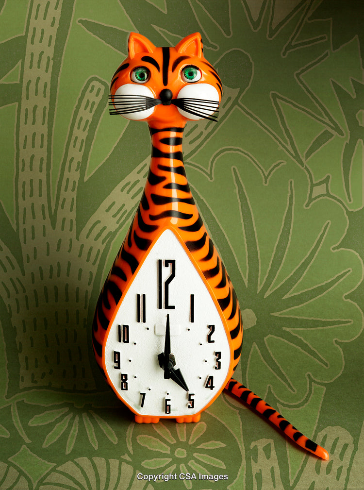 Orange Striped Cat-Shaped Clock with Vibrant Green Eyes on Decorative Background