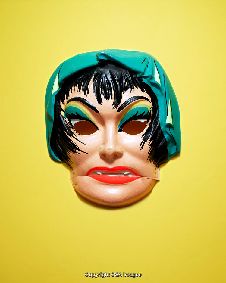Plastic Halloween Mask Against Vibrant Yellow Background