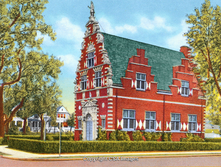 Classic Brick Building with Gabled Roof in a Landscaped Neighborhood Setting