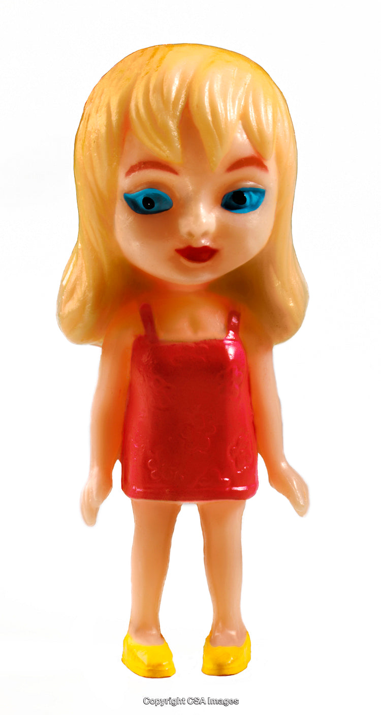 Close-Up of a Blonde Plastic Toy Doll in Red Dress