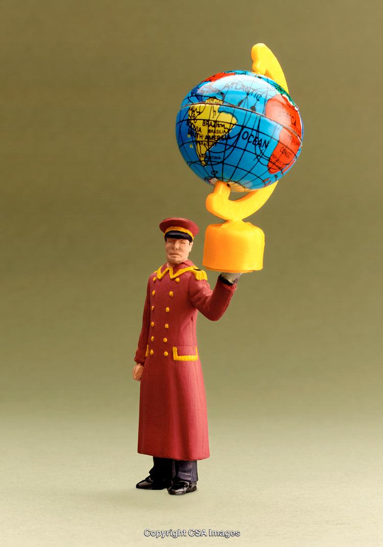 Miniature Bellhop Figurine Holding a Globe as a Trophy on Green Background