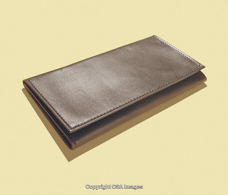 Elegant Brown Leather Wallet on Minimalist Yellow Background