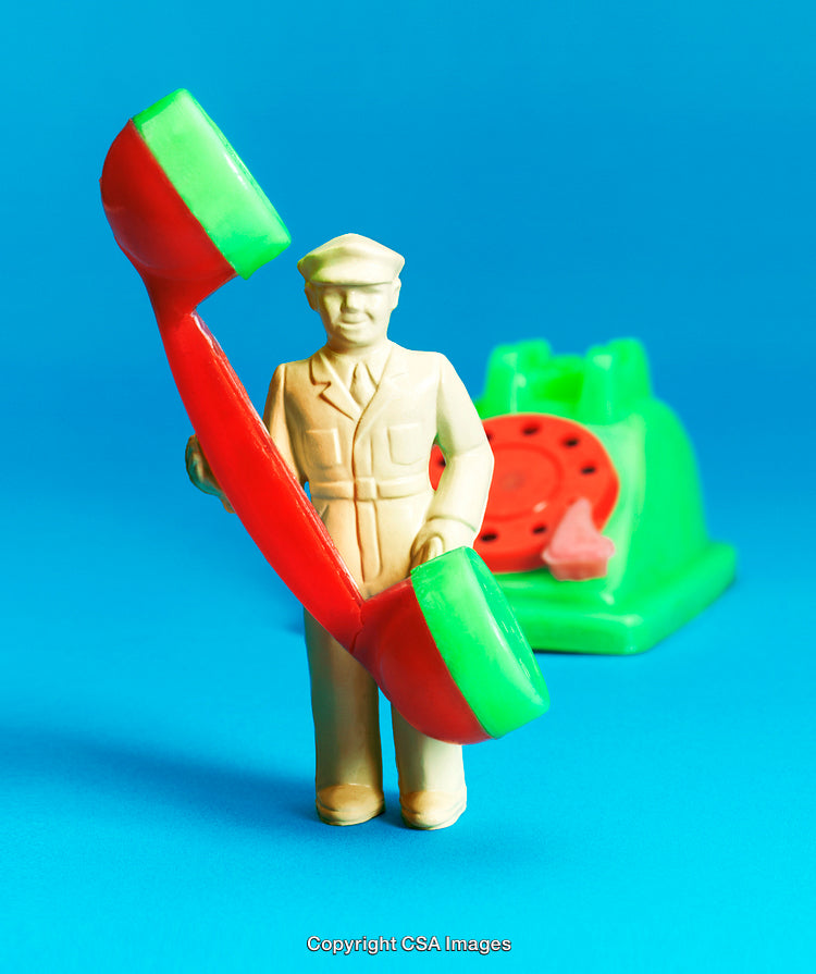 Colorful Toy Soldier Holding Telephone Receiver on Blue Background