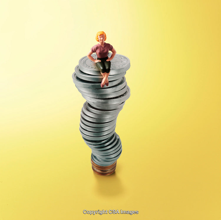 Miniature Person on a Tower of Stacked Coins with Yellow Background
