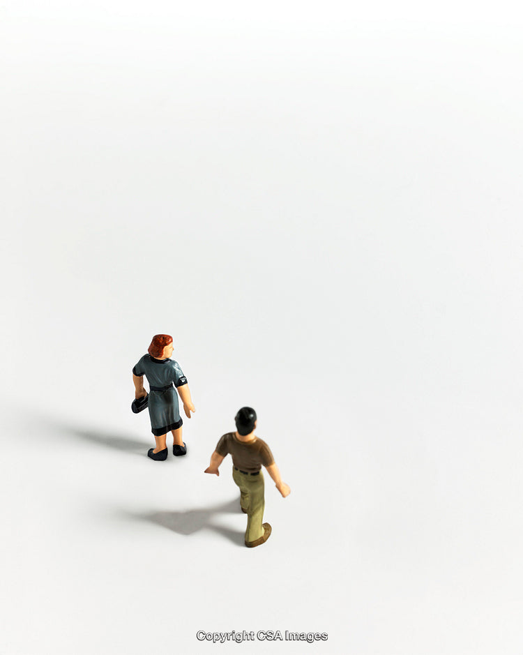 Minimalist Composition with Figurines on White Background