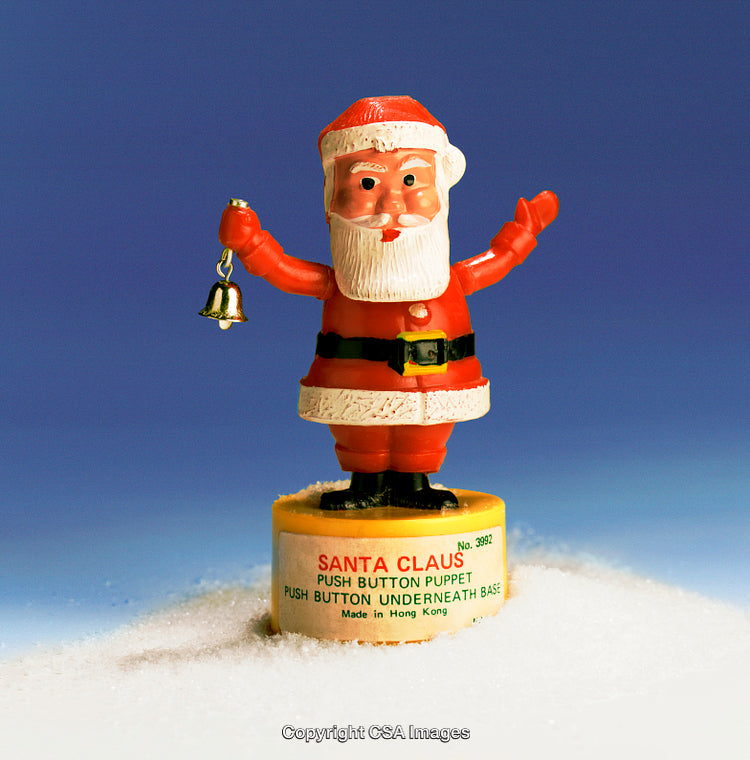 Vintage Santa Claus Plastic Push-Button Toy in Festive Themed Display