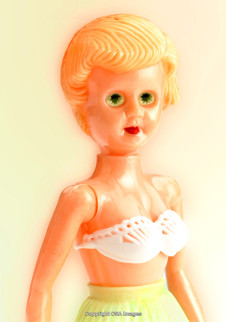 Vintage Plastic Doll Toy with Colorful Clothing and Simple Details