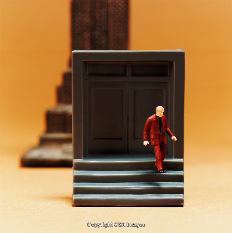 Miniature Businessman Figurine Exiting Building on Bright Background