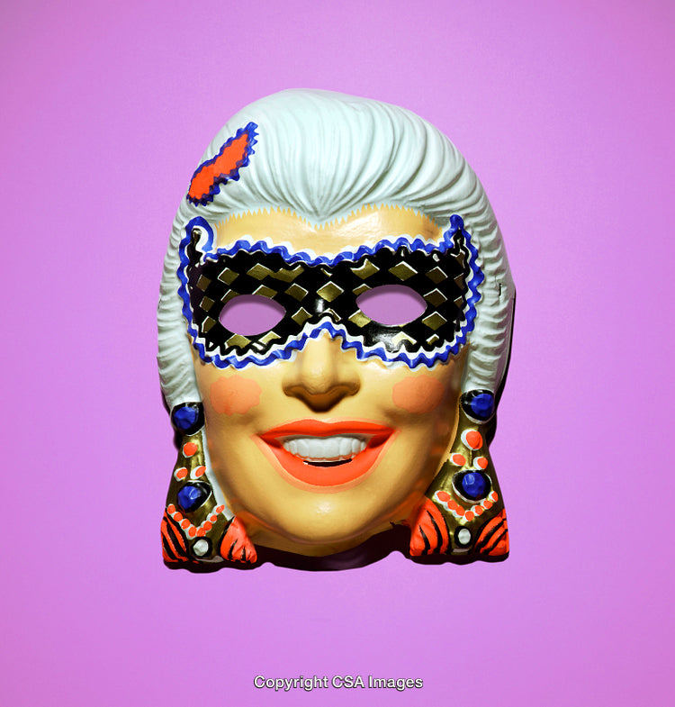 Colorful Plastic Masquerade Mask on Bright Pink Background