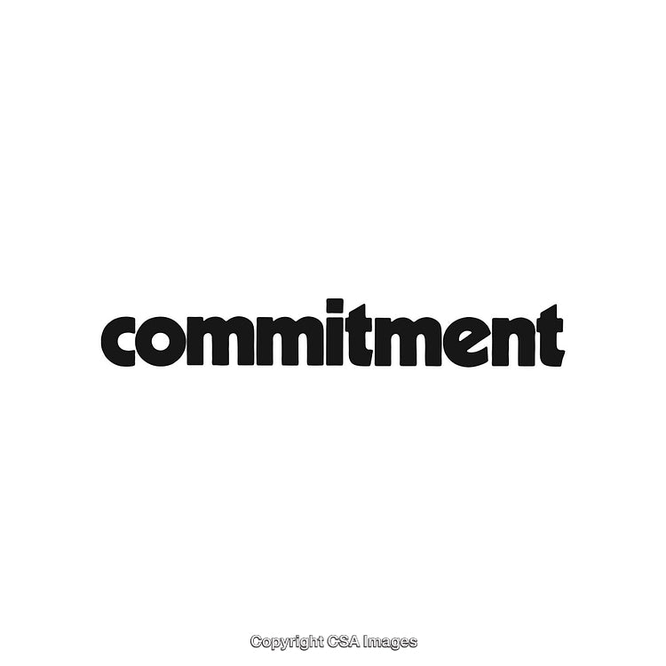 Black Bold Typography of the Word Commitment on a White Background