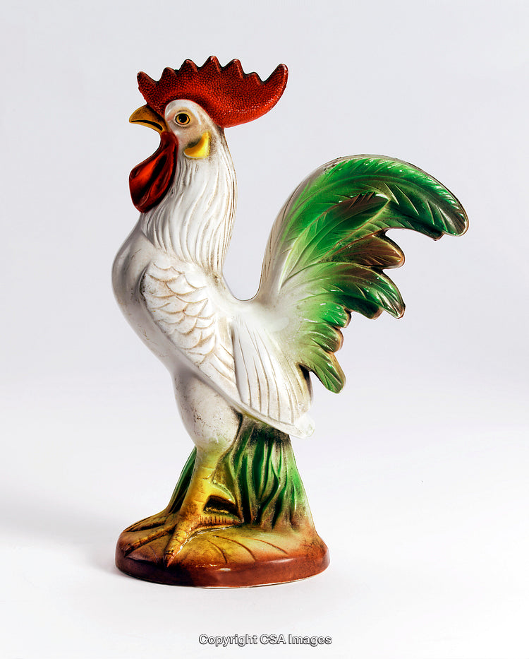 Colorful Ceramic Rooster Figurine on Display Against a Plain Background