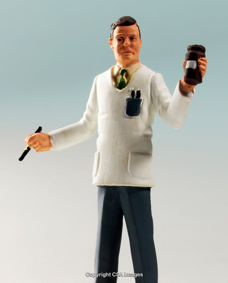 Plastic Figure of a Pharmacist Holding a Medicine Bottle and Pen
