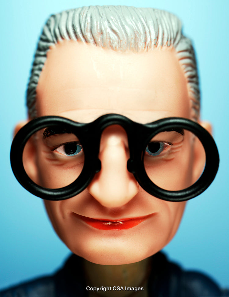 Close-Up of a Toy Figure Wearing Large Black Glasses on Blue Background