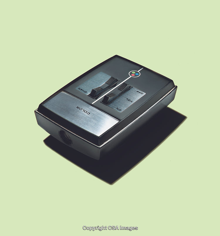 Retro Remote Control Device with Metallic Details on Pastel Background