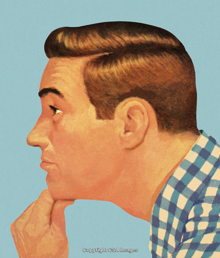 Thoughtful Man Wearing A Vintage Shirt in Profile Against a Blue Background