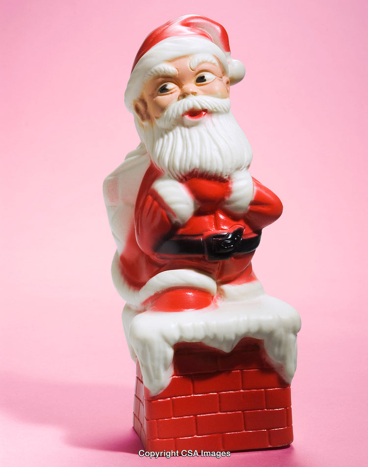 Santa Claus Figurine on Chimney with Bright Pink Background