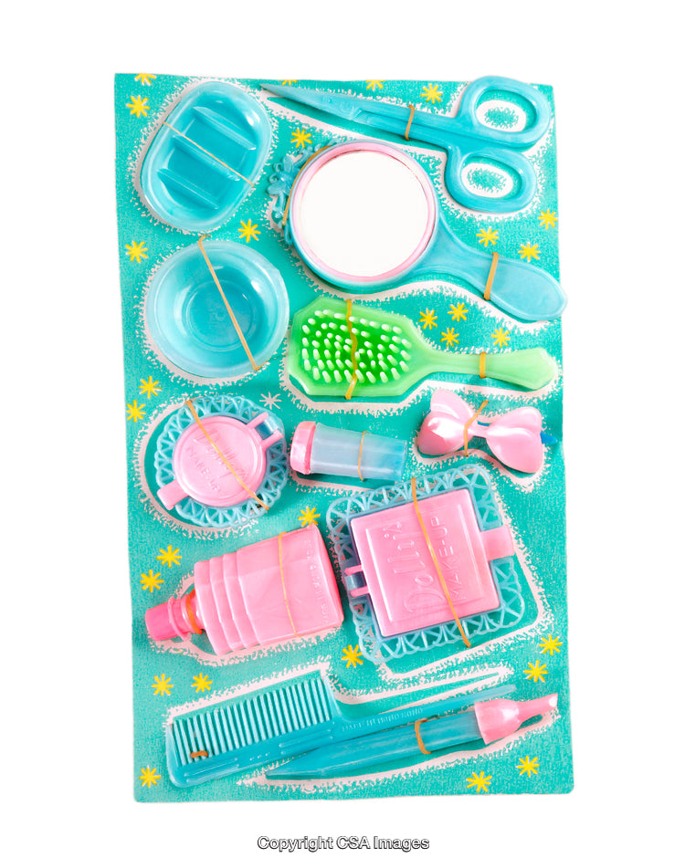 Colorful Plastic Toy Beauty Set for Children Organized on a Display Board