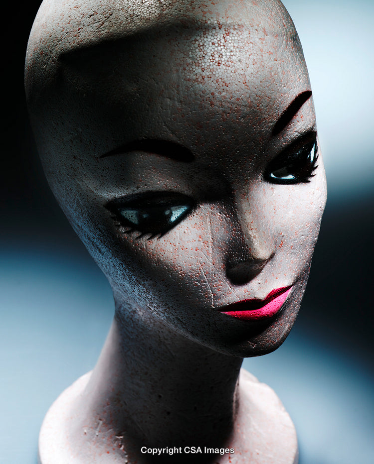 Abstract Artistic Mannequin Bust With Dramatic Lighting Against Blue Background