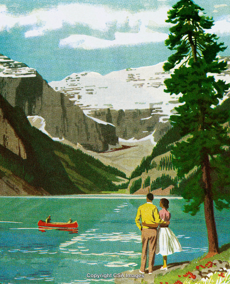 Couple Enjoying Scenic Lake View with Snowy Mountain Backdrop