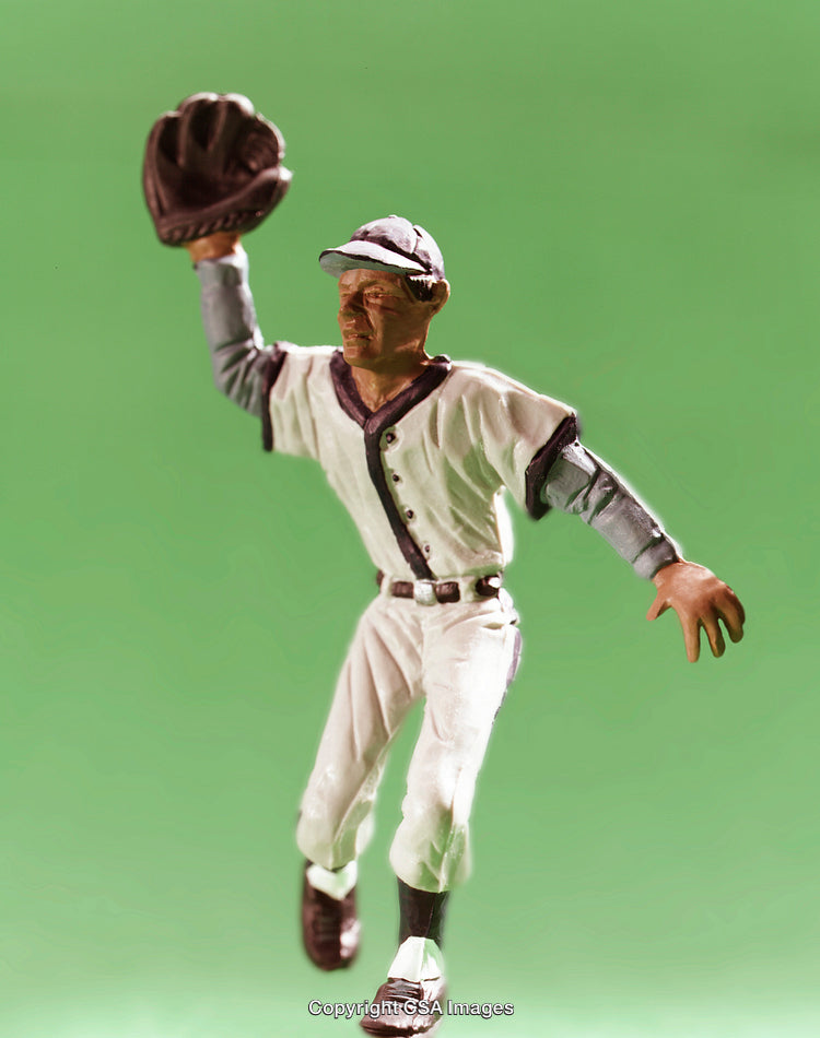 Vintage Baseball Player Figurine on Bright Green Background