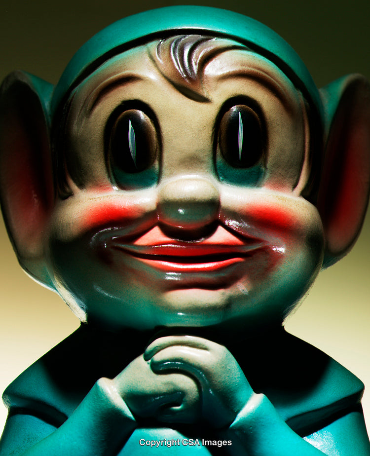 Close-Up of a Smiling Plastic Toy Elf Figurine