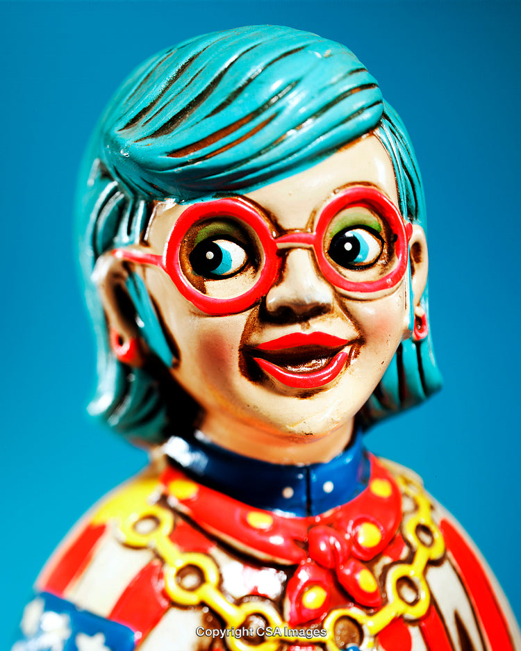 Colorful Figurine with Vibrant Expression and Retro Charm on Blue Background