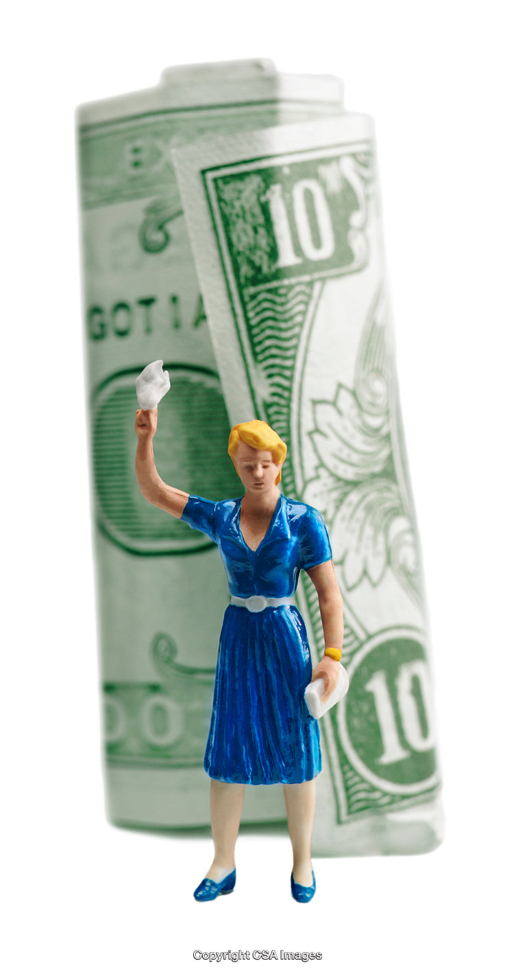 Miniature Figurine in Blue Dress Beside Rolled Ten Dollar Bill