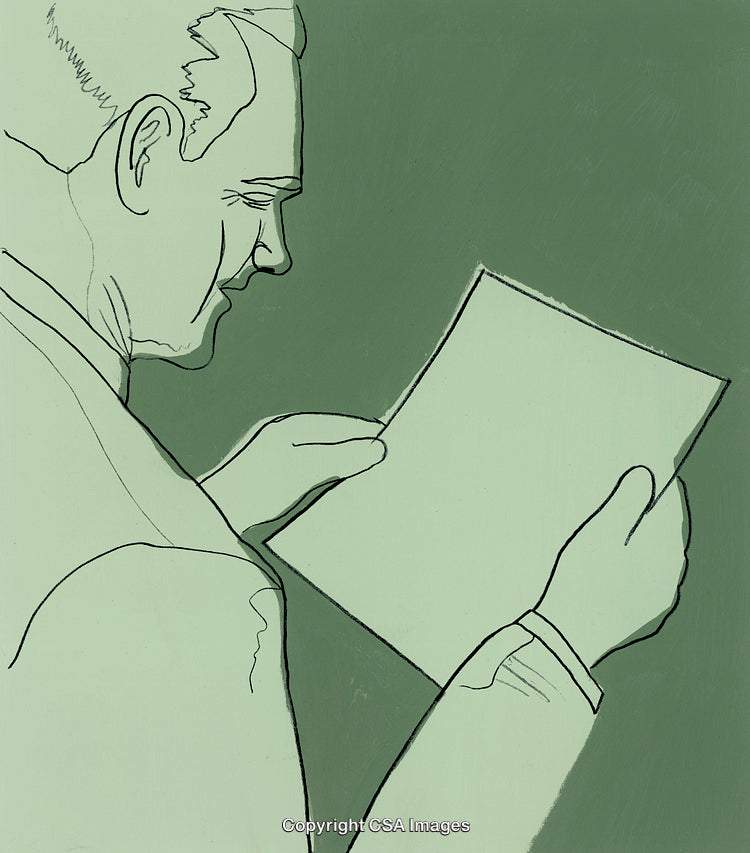 Businessman Looking at a Piece of Paper