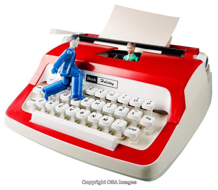 Plastic Figurines on a Retro Red and White Toy Typewriter
