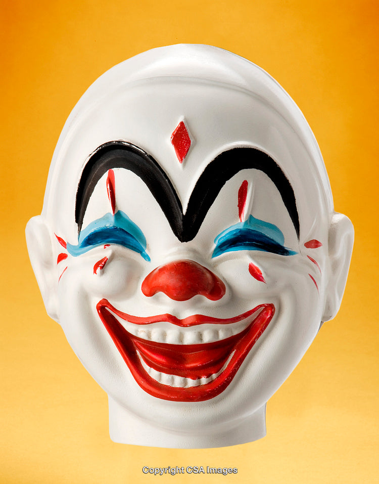 Colorful Clown Mask Against Vibrant Yellow Background