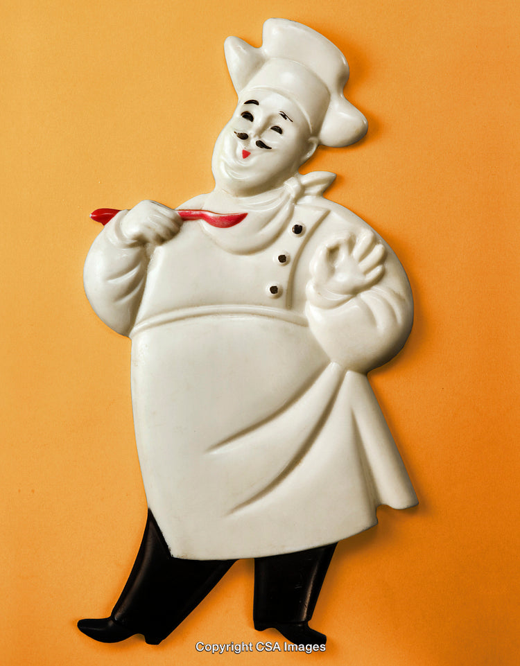 Cheerful Chef Decor Figure With White Apron and Red Spoon on Orange Background