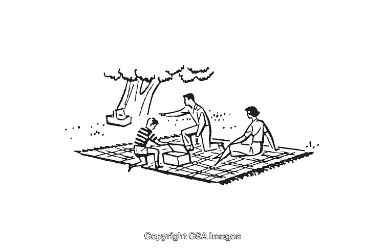 Group Enjoying Outdoor Leisure Activities on a Blanket Under a Tree