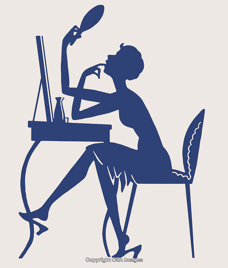 Elegant Silhouette of a Woman Using a Mirror at a Dressing Table
