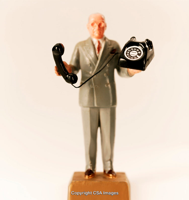 Retro Toy Figure Holding Rotary Telephone in Classic Suit Style