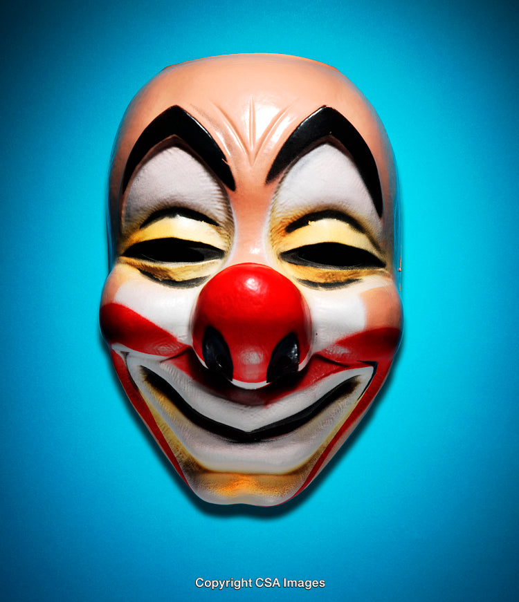 Colorful Clown Mask Against a Bright Blue Studio Background