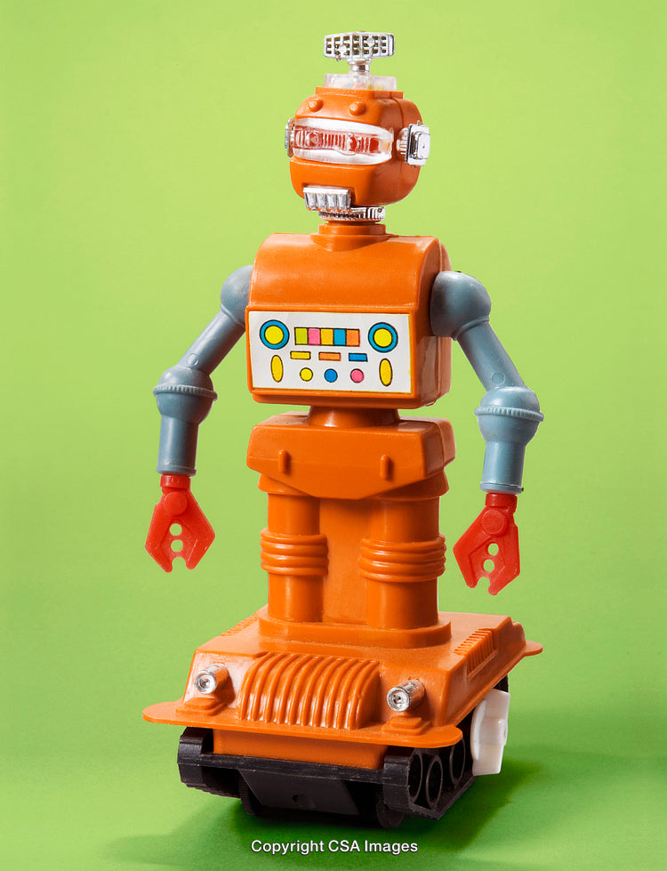 Retro Orange Robot Toy Standing Against a Vibrant Green Background