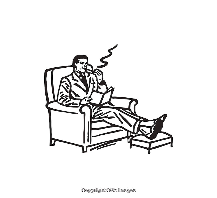 Man Relaxing in Armchair Reading a Book and Smoking a Pipe