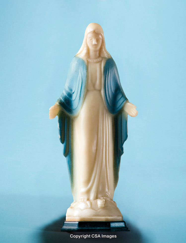 Plastic Figurine of a Religious Figure on a Light Blue Background