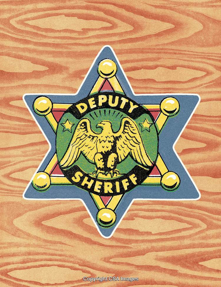 Vintage Deputy Sheriff Badge in a Star Design With Wooden Background