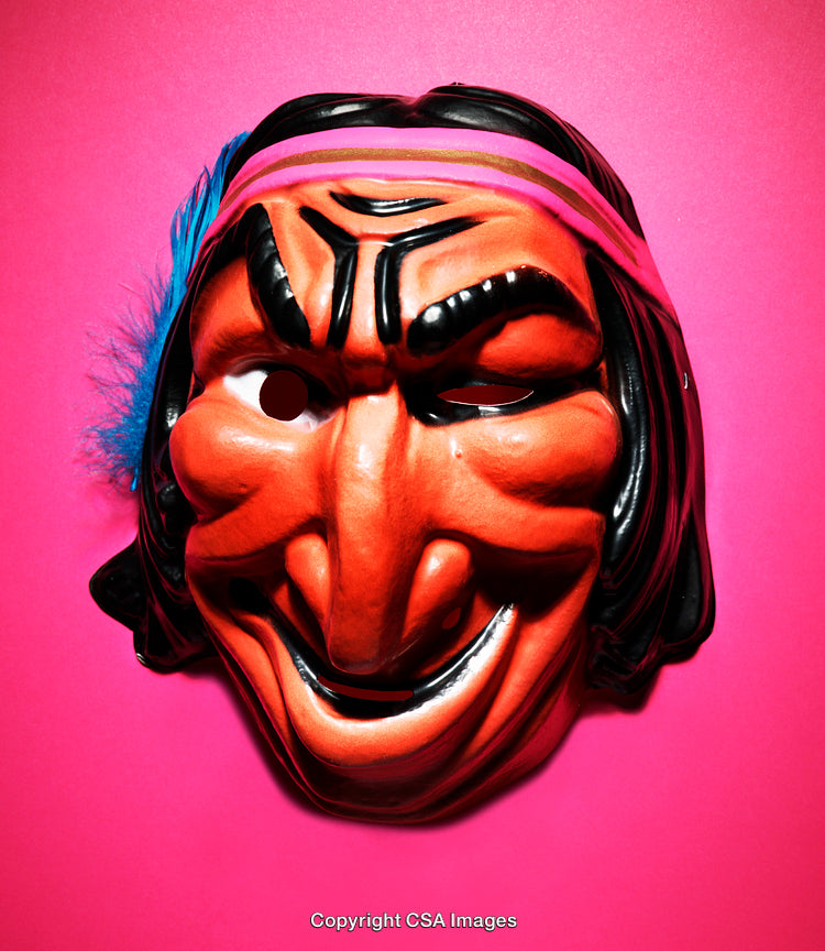 Vintage Plastic Mask Against Vibrant Pink Background