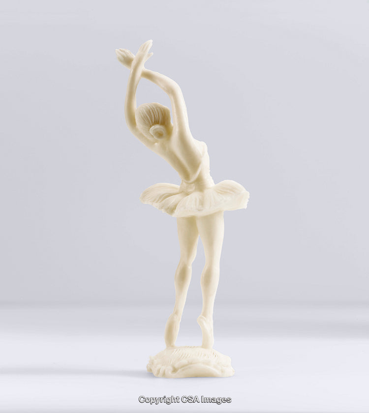 Elegant Ballerina Figurine in Graceful Pose Against Neutral Backdrop