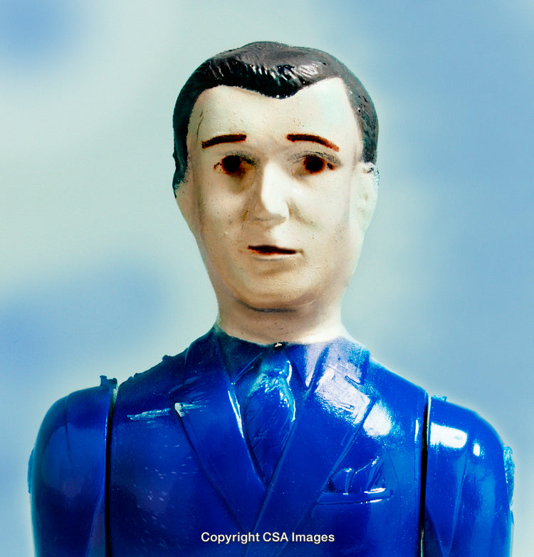 Close-Up of a Blue Plastic Toy Figurine Against a Sky Background