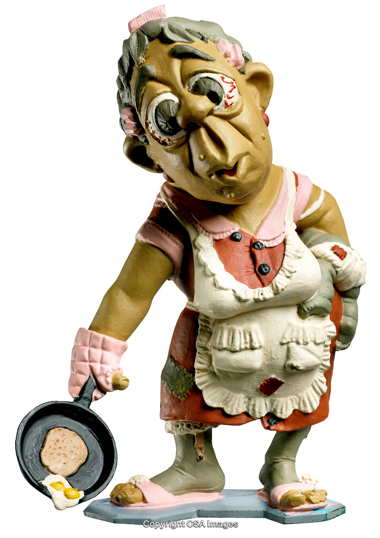 Humorous Figurine of a Grandma Cooking Pancakes in Vintage Attire